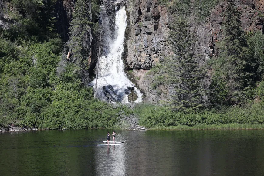 Paddle board to waterfalls at Siwash Lake Luxury Resort & Ranch